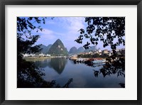 Framed Wonderful ragged Limestone Mountains and Li River and city life of Yangshuo area of China