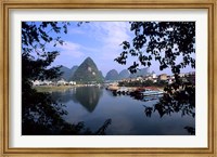 Framed Wonderful ragged Limestone Mountains and Li River and city life of Yangshuo area of China