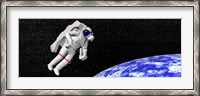 Framed Astronaut floating in outer space above planet Earth