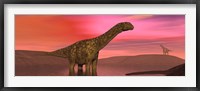 Framed Argentinosaurus dinosaurs amongst a colorful red sunset