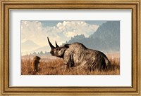 Framed marmot approaches an old and grey woolly rhinocerous