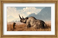 Framed marmot approaches an old and grey woolly rhinocerous