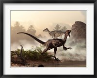 Framed pair of velociraptors patrol the shore of an ancient lake