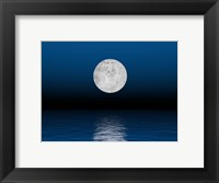 Framed Beautiful full moon against a deep blue sky over the ocean