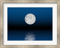 Framed Beautiful full moon against a deep blue sky over the ocean