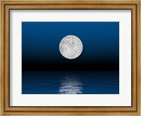 Framed Beautiful full moon against a deep blue sky over the ocean