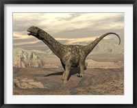Framed Large Argentinosaurus dinosaur walking on rocky terrain