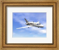 Framed Private jet plane flying in cloudy blue sky