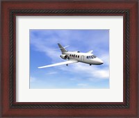 Framed Private jet plane flying in cloudy blue sky