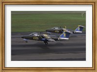 Framed Saab 105 jet trainers on the strip