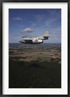 Framed Saab J 29 jet fighter flying over landscape