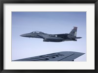 Framed US Air Force F-15E Strike Eagle over the wing of a KC-135 Stratotanker