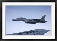 Framed US Air Force F-15E Strike Eagle over the wing of a KC-135 Stratotanker