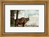 Framed woolly rhinoceros trudges through the snow, Pleistocene epoch