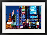 Framed neon signs along the shopping and business center at night, Nanjing Road, Shanghai, China