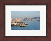 Framed Kowloon ferry terminal and clock tower, Hong Kong, China