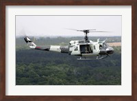 Framed US Air Force UH-1H Huey in an experiment paint scheme