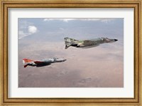 Framed Two QF-4E Phantom II drones in formation over the New Mexico desert
