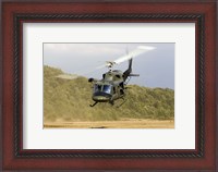 Framed Italian Air Force AB-212 ICO helicopter departs the landing zone, Italy