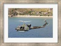 Framed Italian Air Force AB-212 ICO helicopter in flight over Italy