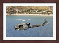 Framed Italian Air Force AB-212 ICO helicopter in flight over Italy