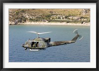 Framed Italian Air Force AB-212 ICO helicopter in flight over Italy