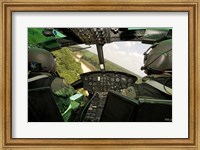 Framed Two instructor pilots practice low flying operations in a UH-1H Huey helicopter