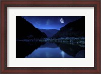 Framed Moon rising over tranquil lake and forest against starry sky, Bulgaria
