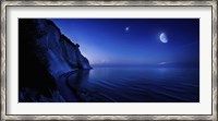 Framed Moon rising over tranquil sea and Mons Klint cliffs, Denmark