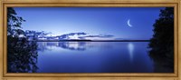 Framed Moon rising over tranquil lake against moody sky, Mozhaisk, Russia