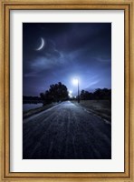 Framed road in a park at night against moon and moody sky, Moscow, Russia