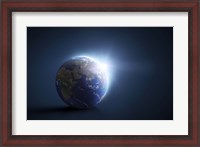 Framed Planet Earth and sunlight on a dark blue background