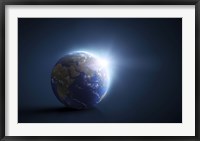 Framed Planet Earth and sunlight on a dark blue background