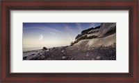 Framed Tranquil seaside and Mons Klint cliffs against rising moon, Denmark