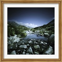 Framed Small river flowing through big stones in Pirin National Park, Bulgaria