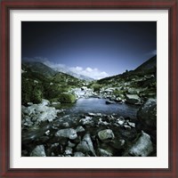 Framed Small river flowing through big stones in Pirin National Park, Bulgaria