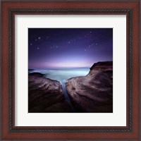Framed Two large rocks in a sea, against starry sky