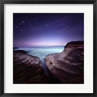 Framed Two large rocks in a sea, against starry sky