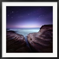 Framed Two large rocks in a sea, against starry sky