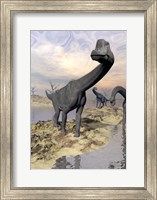 Framed Brachiosaurus dinosaurs near water with reflection by sunset and full moon
