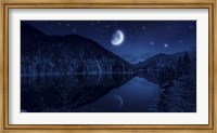 Framed Moon rising over tranquil lake in the misty mountains against starry sky