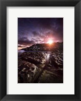 Framed Rocky shore and tranquil sea against cloudy sky at sunset, Sardinia, Italy