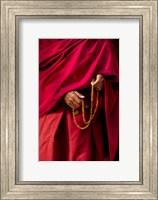 Framed Hands of a monk in red holding prayer beads, Leh, Ladakh, India