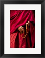 Framed Hands of a monk in red holding prayer beads, Leh, Ladakh, India