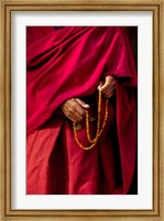 Framed Hands of a monk in red holding prayer beads, Leh, Ladakh, India