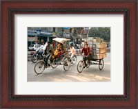 Framed People and cargo move through streets via rickshaw, Varanasi, India