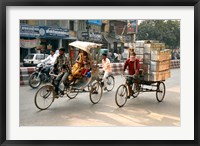 Framed People and cargo move through streets via rickshaw, Varanasi, India