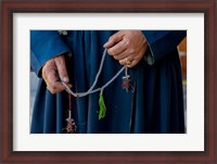 Framed Woman's hands holding prayer beads, Ladakh, India