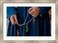 Framed Woman's hands holding prayer beads, Ladakh, India