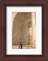 Framed Visitors dwarfed by the Taj Mahal, Agra, Uttar Pradesh, India